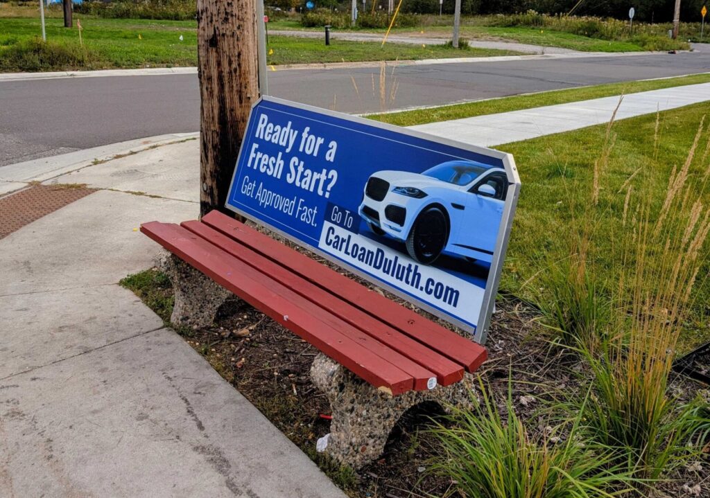 bus bench in Duluth for a car dealership